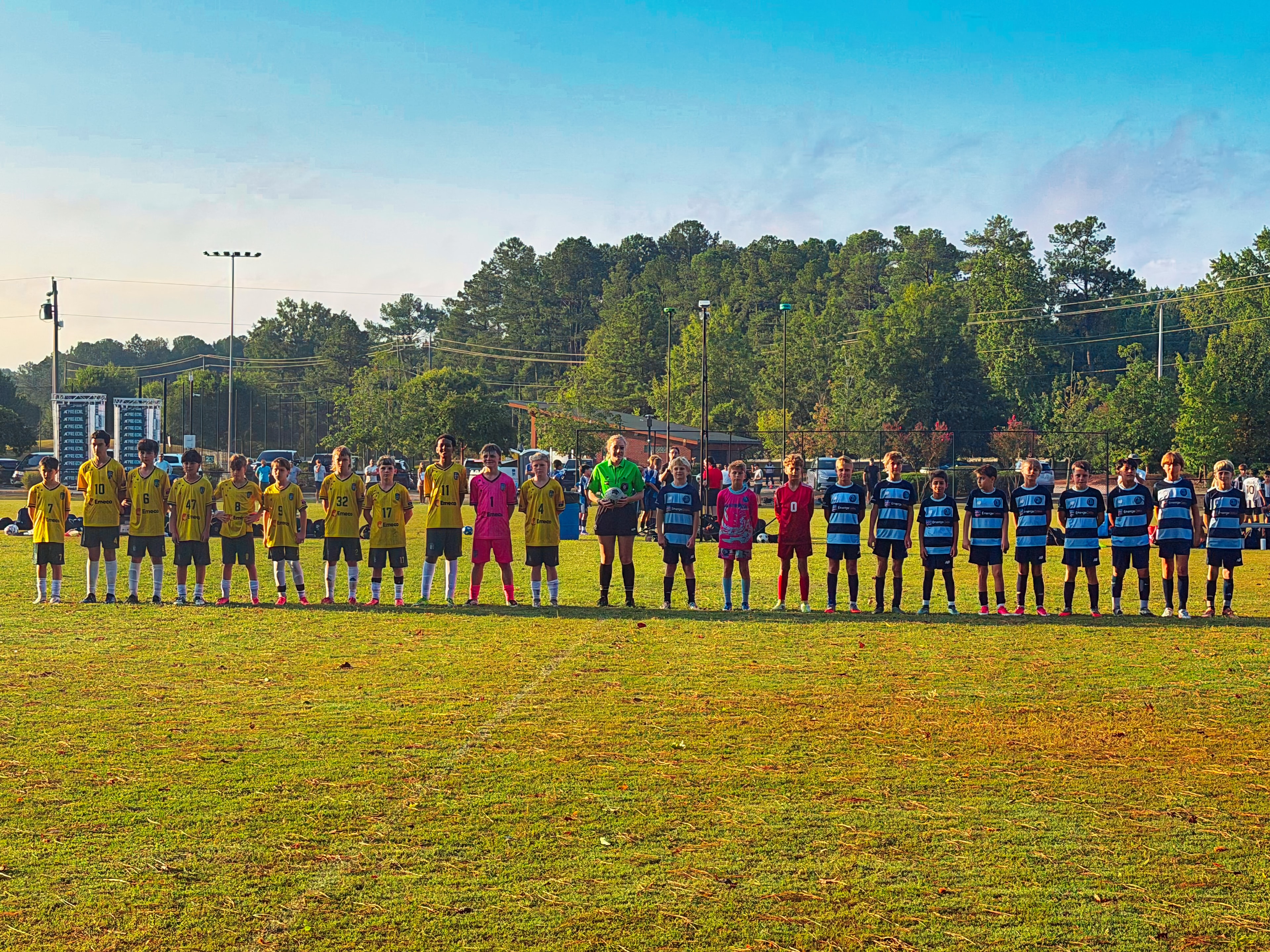 Teams lined up on field before match