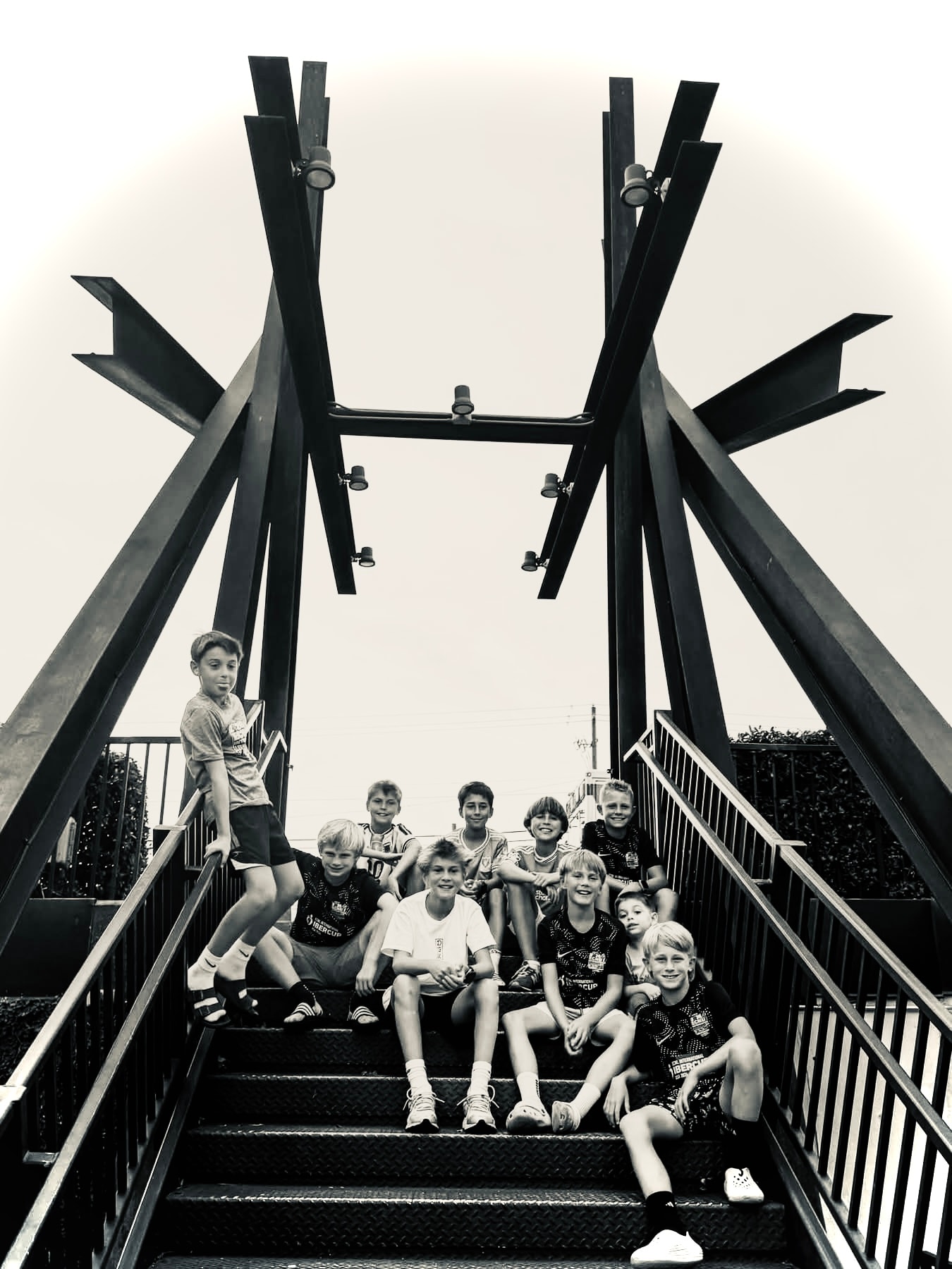 Team group photo on bridge staircase
